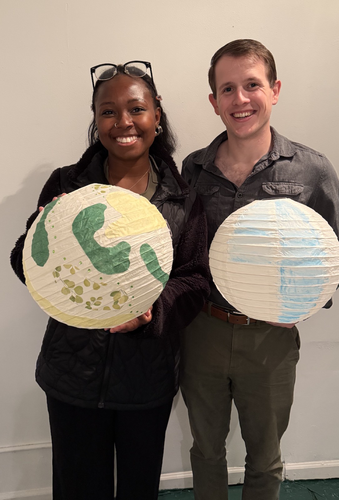 Two finished lanterns with leaf and sky designs